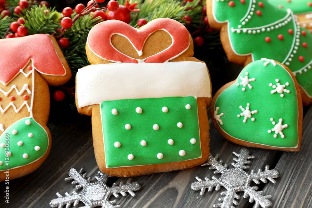 Tasty gingerbread cookies on wooden background, close up