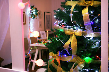 Poster - Beautiful decorated Christmas tree at night, view from window