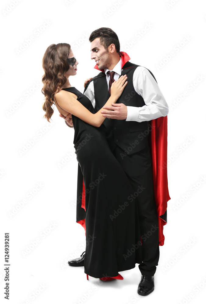 Young couple dressed in vampire costumes for Halloween, isolated on white