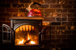 Cozy, warm fire heating a kettle against a brick hearth