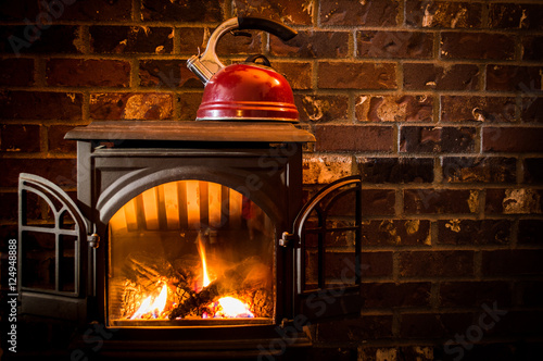 Cozy Warm Fire Heating A Kettle Against A Brick Hearth Buy This