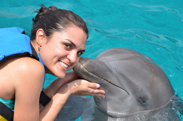 dolphin kiss young woman