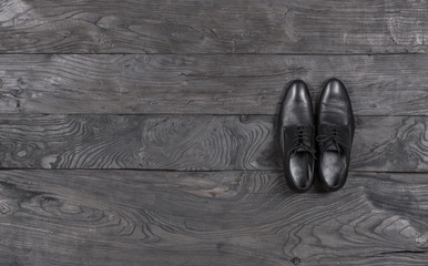 Wall Mural - black male elegant shoes on a black background