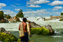 Khone Phapheng Falls And Fisherman On Beautiful Sky, Laos