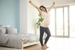 © gpointstudio - Pregnant woman stretching after good night