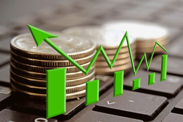 The green arrow on the background of money . The concept of changes in Bank interest rates .