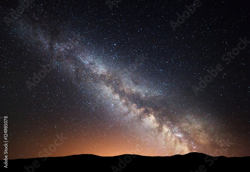 Night Landscape With Amazing Milky Way And Yellow Light At