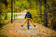 Urban biking - woman riding bike in city park 