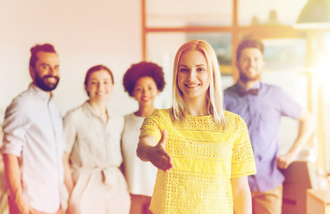 Sticker - woman making handshake over creative office team