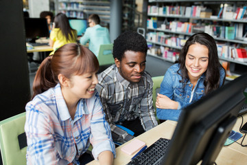 Poster - international students with computers at library