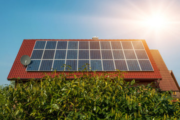 Wall Mural - Solar panel on a red roof