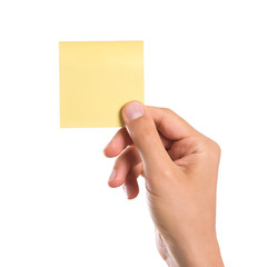 Hand holding sticky note