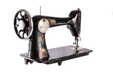 The Old Sewing Machine On A White Background