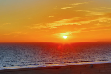 Wall Mural - The Pacific Ocean is during sunset. Landscape with blue sea, the mountains and the dusk sky, the USA, Santa Monica. 