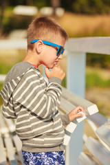 Portrait of boy outdoor in summer time.