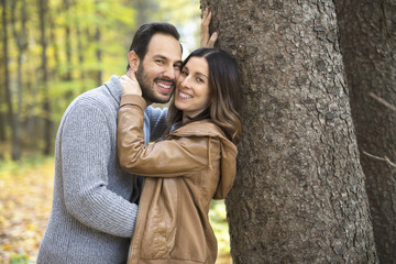 Nice couple having fun in autumn park