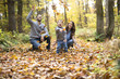 © Louis-Paul Photo - Happy family relaxing outdoors In autumn park