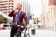 © Sergey Nivens - Young businessmen with a bike