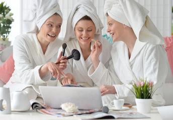 young women wearing a white bathrobes