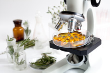 Concept - Check Dietary Supplements In Laboratory On Microscope