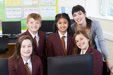 Wall Mural - Portrait Of Elementary School Pupils With Teacher In Computer Cl