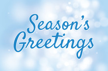 Season's Greetings With Blue Bokeh Background For Christmas Them