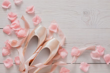 Pink Ballet Pointe Shoes On White Wood Background