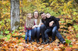 © Louis-Paul Photo - Family of four enjoying golden leaves in autumn park