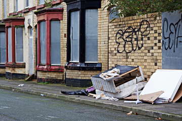 A street of boarded up derelict houses awaiting regeneration in Liverpool UK