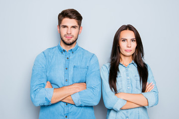 Portrait of confident serious man and woman with crossed hands