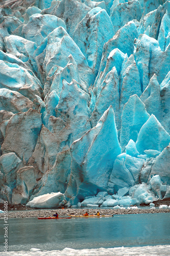 Fotografie, Obraz Kayakers paddling in front of Holgate Glacier in Alaska at Kenai