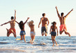 © Africa Studio - Happy friends jumping on beach