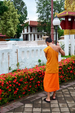 Novice Monk Use Sweep Cleaning Front Of Ubosot T Wat Phu Mintr O