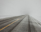 Fototapeta Do przedpokoju - WInter driving in blowing snow