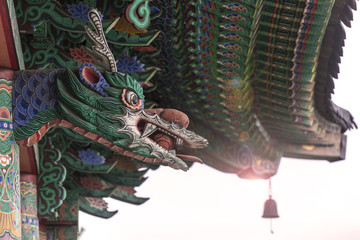 Traditional Asian wooden temple with Dragon over the main Entrance