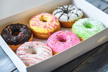 Colorful donuts in box