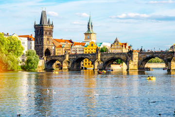 Wall Mural - Citycsape view on the riverside with the bridge and old town in Prague