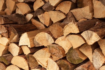 wall firewood , Background of dry chopped firewood logs in a pile. Stack of logs felled and left to dry.
