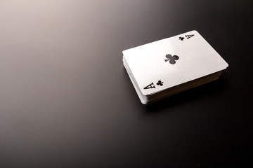 poker chips and cards on black background