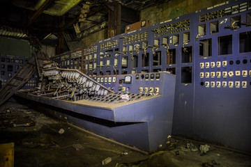 Wall Mural - Destroyed by war and abandoned control panel on abandoned power plant 