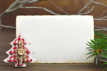 Creative layout made of vintage Christmas tree decoration and paper card note. New Year background concept with copy space.