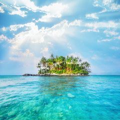 Ocean landscape with palm trees at tropical island under blue sky. Thailand travel landscapes and destinations