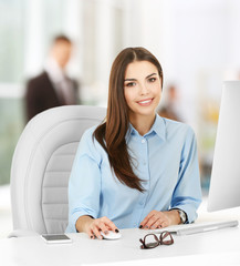 Wall Mural - Young woman working at modern office. Business concept.