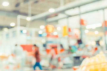 Poster - Blurred background, customer pay money at Cashier in supermarket