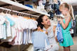 © JackF - Mother with daughter buying clothes