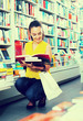 © JackF - Woman looking at book