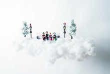 Christmas Carolers Floating On A Cloud Of Cotton
