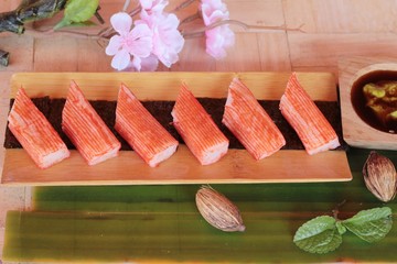 Sticker - Crab stick with wasabi sauce and making sushi.