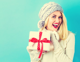 Young woman holding a Christmas gift