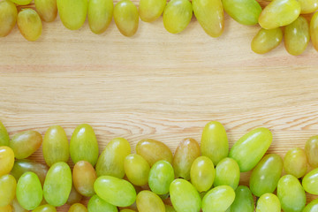Wall Mural - Grapes on a wooden table